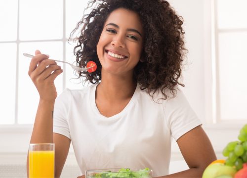 Woman following lifestyle recommendations by eating healthy