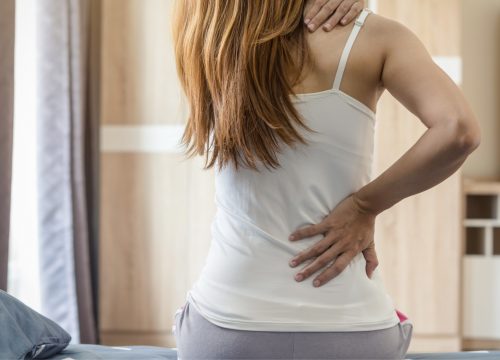 woman experiencing nagging pain on her hip