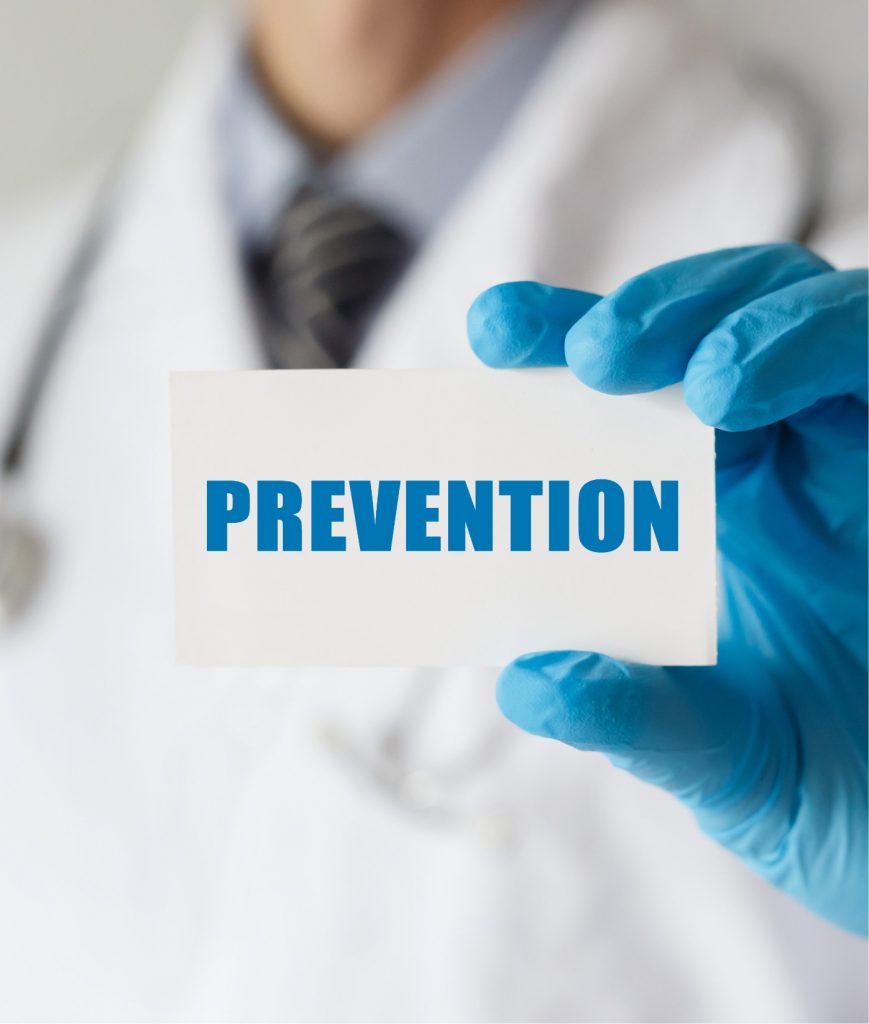 Doctor holding up a card that says prevention